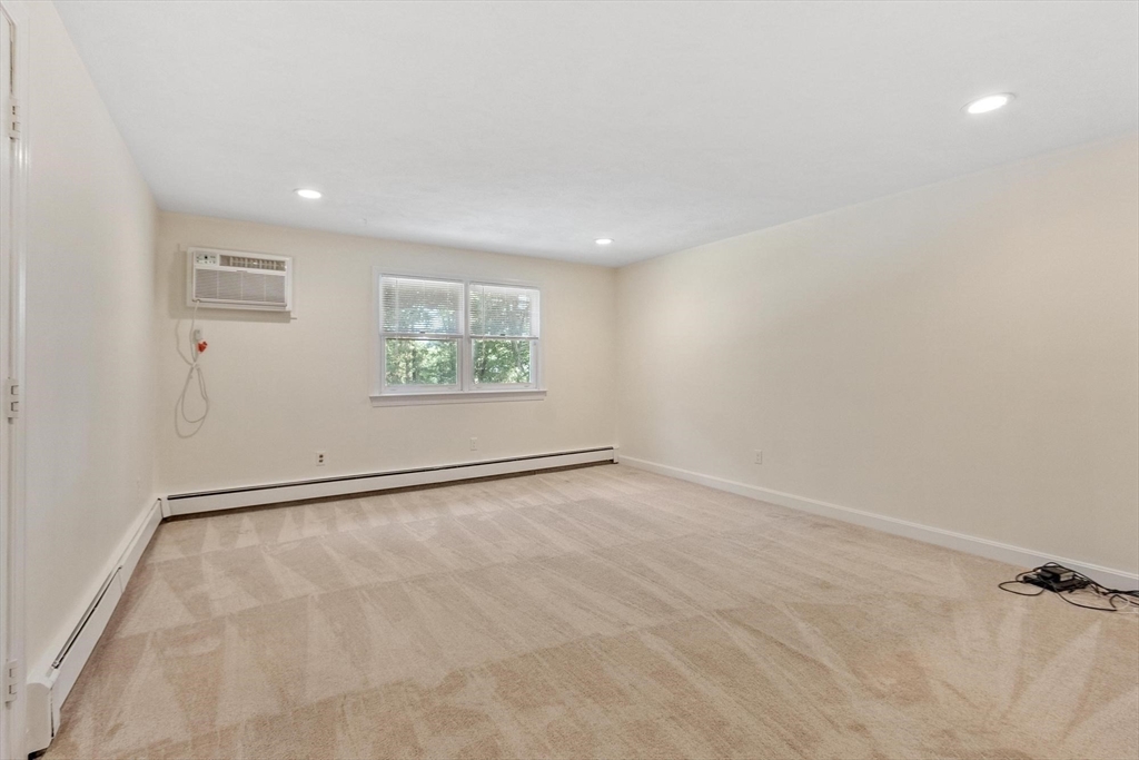 420 Great Road, Unit C1 Acton, MA 01720 - Photo 19 of 29 a view of an empty room with a window