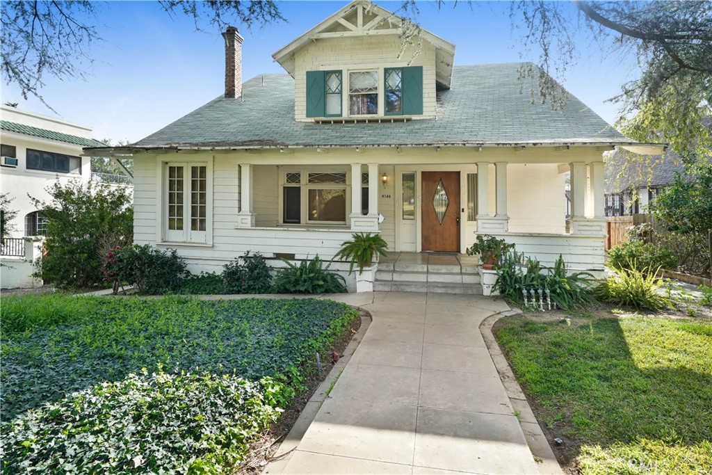 4586 6th Street Riverside, CA 92501 - Photo 1 of 1 a front view of a house with a yard