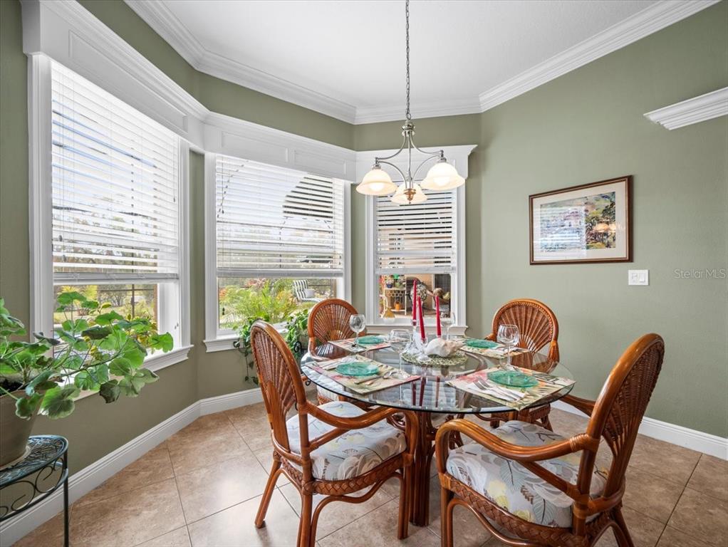 8480 Athens Court Weeki Wachee, FL 34613 - Photo 19 of 60 a view of a dining room with furniture window and outside view