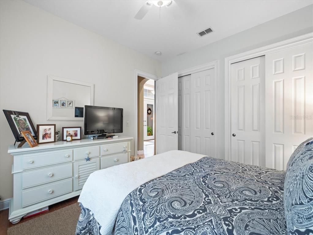 8480 Athens Court Weeki Wachee, FL 34613 - Photo 28 of 60 a bedroom with a bed and a flat screen tv in it