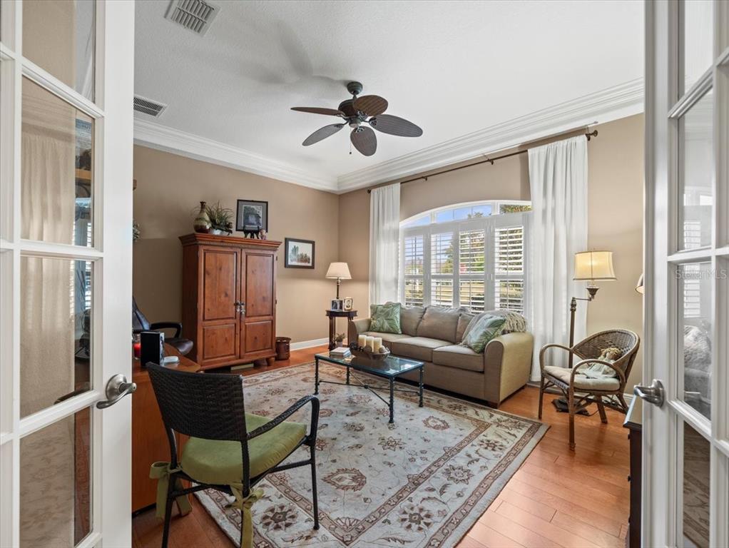 8480 Athens Court Weeki Wachee, FL 34613 - Photo 30 of 60 a living room with furniture and a large window