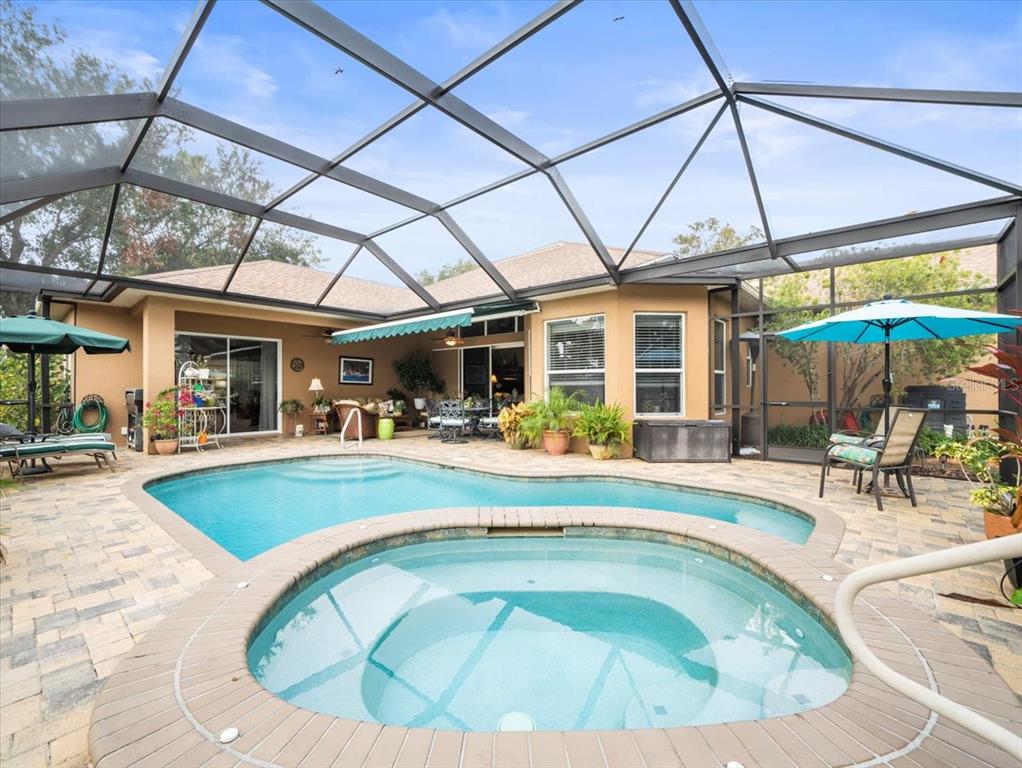 8480 Athens Court Weeki Wachee, FL 34613 - Photo 48 of 60 a view of a swimming pool with a patio