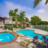 a view of a swimming pool with a lounge chairs