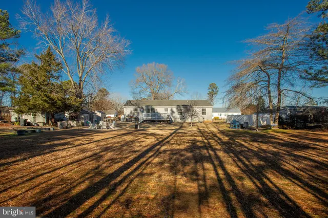 a view of balcony with wooden floor and fence