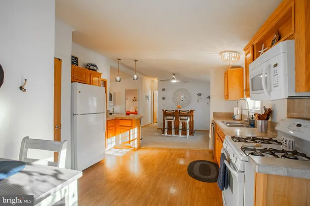 a workspace with furniture and a chandelier