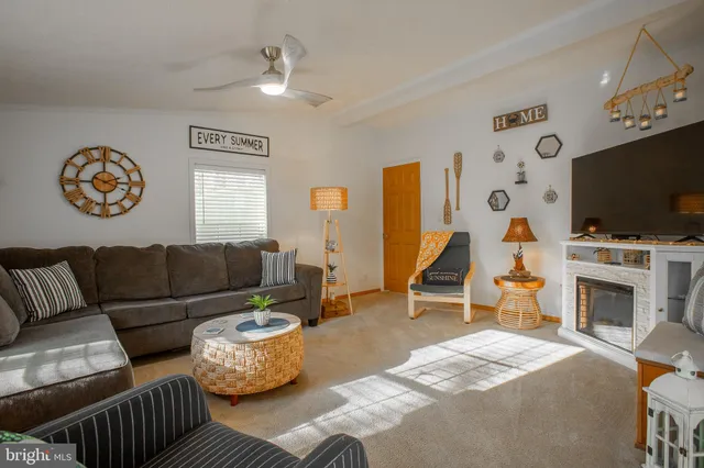 a bedroom with a bed and a tv on the dresser