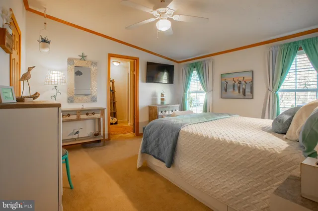 a bathroom with a sink mirror vanity and toilet