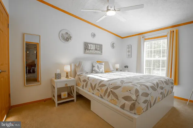 a bathroom with a granite countertop toilet sink and mirror