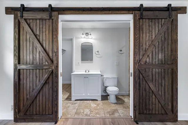 a bathroom with a sink and mirror