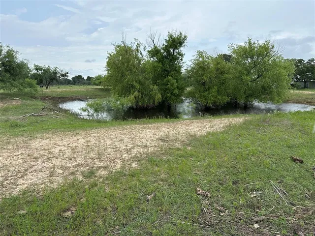 a view of a lake view with a big yard