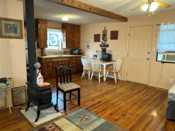 a living room with furniture a window and a table