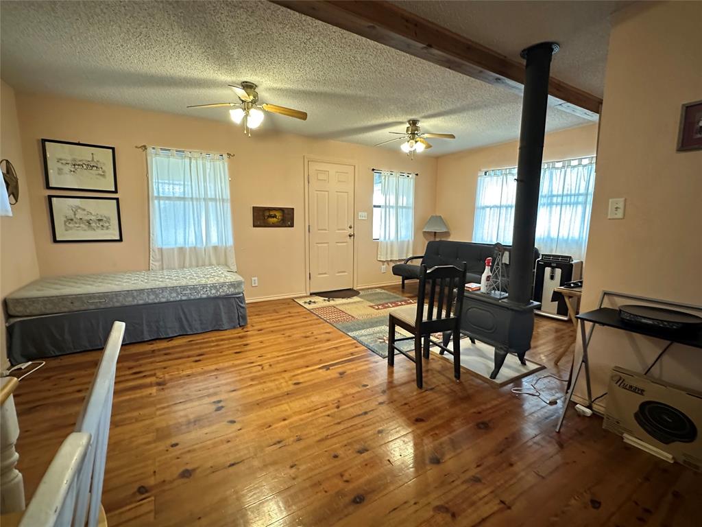 8343 County Road 270 Zephyr, TX 76890 - Photo 15 of 38 a living room with furniture and wooden floor