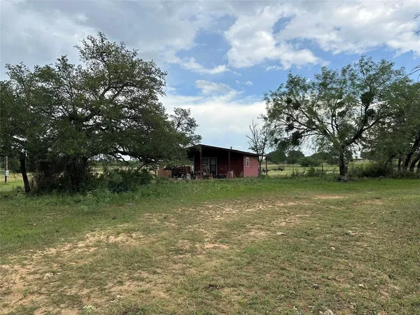 a fire hydrant in the middle of a field