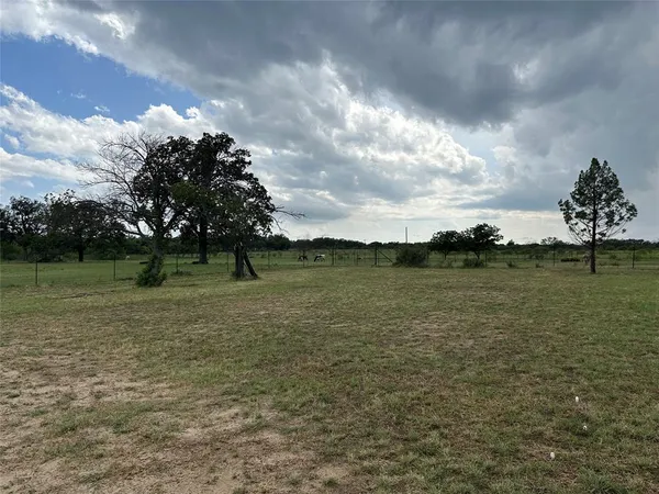 a view of lake with green space
