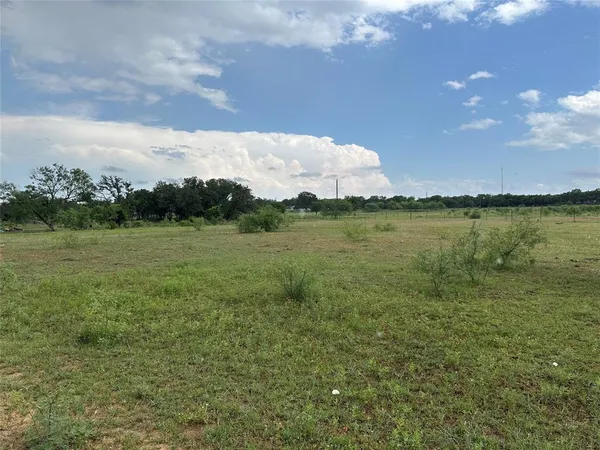 a view of a lake with a big yard