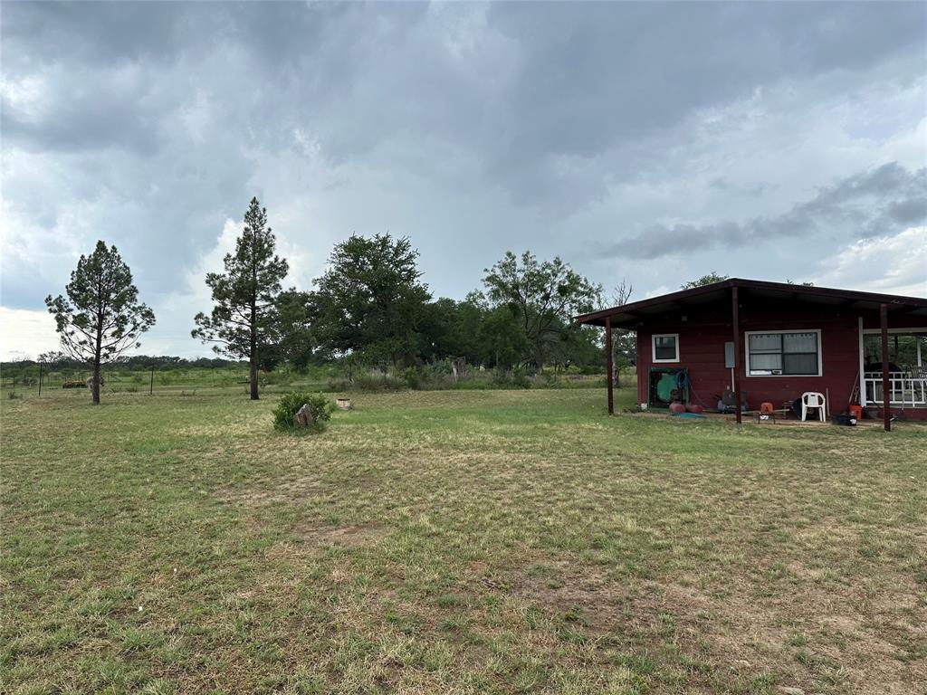 8343 County Road 270 Zephyr, TX 76890 - Photo 4 of 38 a view of a house with a yard