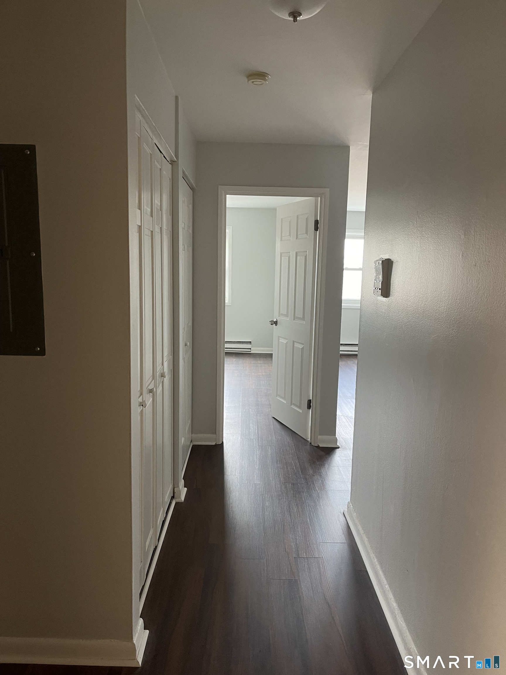 45 Monroe Street, Unit B2 Bridgeport, CT 06605 - Photo 5 of 12 a view of a hallway with wooden floor