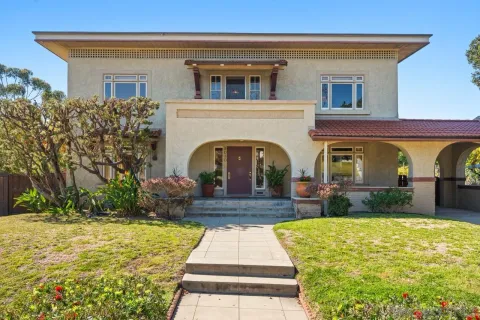 a bathroom with a sink and mirror with toilet
