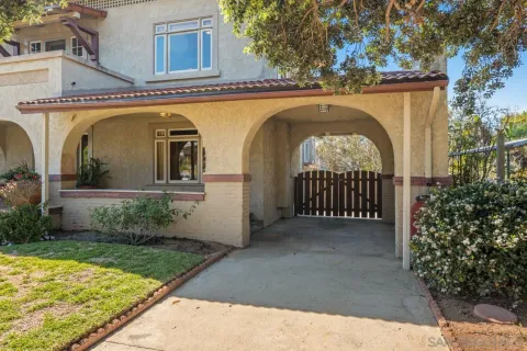 a living room with furniture large window and fireplace