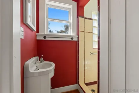 a bathroom with a shower and a tub