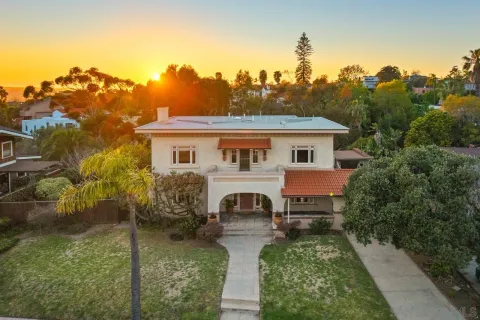 a view of a hallway view with wooden floor and staircase