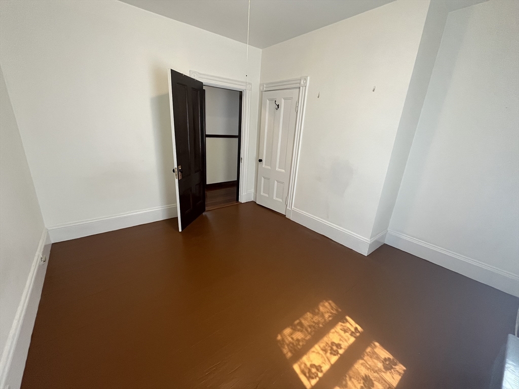 32 Howell Street, Unit 2 Boston, MA 02125 - Photo 21 of 24 an empty room with windows