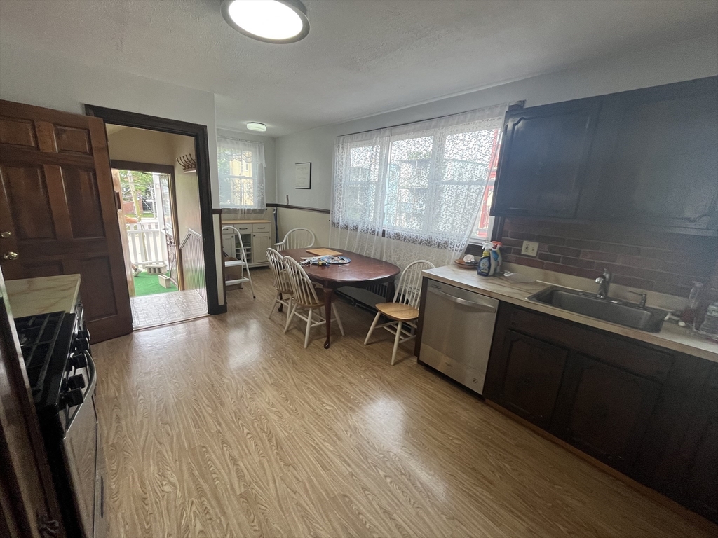 32 Howell Street, Unit 2 Boston, MA 02125 - Photo 4 of 24 a room with furniture a window and wooden floor