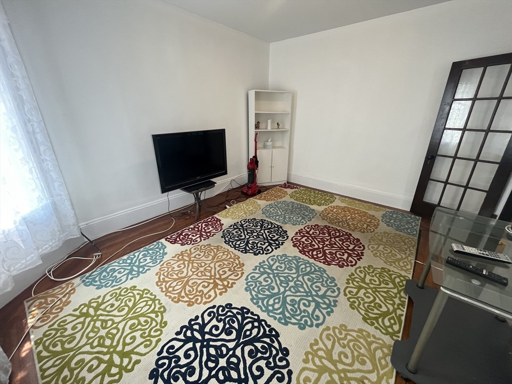 32 Howell Street, Unit 2 Boston, MA 02125 - Photo 6 of 24 a bedroom with a bed and a window