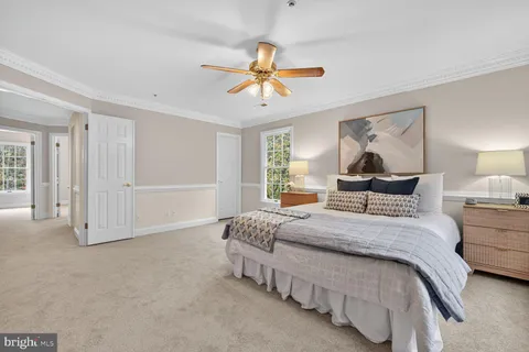 a bedroom with bed and window