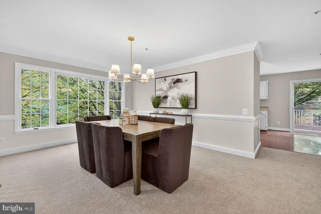 a view of kitchen with granite countertop cabinets and outdoor view