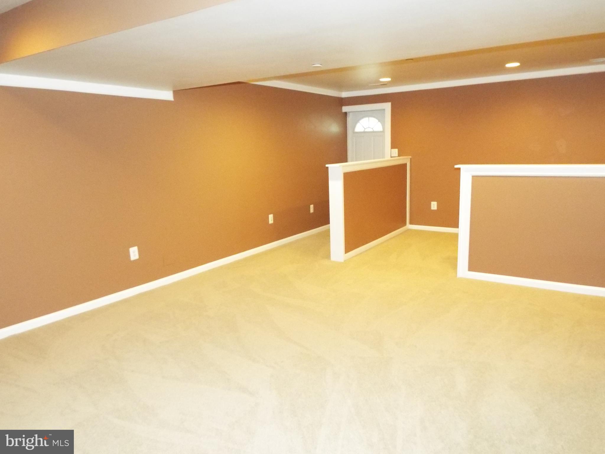 8177 Ridgely Loop Severn, MD 21144 - Photo 31 of 44 Rec Room with Walkup Access