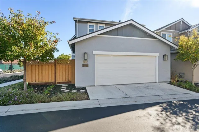 a front view of a house with garage