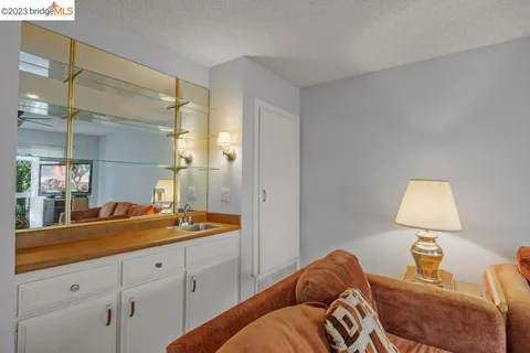 a kitchen with a stove a refrigerator and a kitchen island