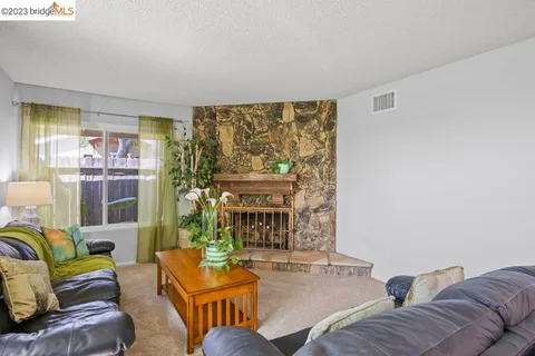 a stove top oven sitting inside of a kitchen