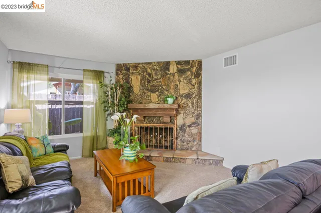 a stove top oven sitting inside of a kitchen
