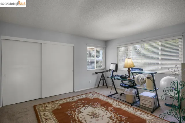 a bedroom with a bed and a cabinets