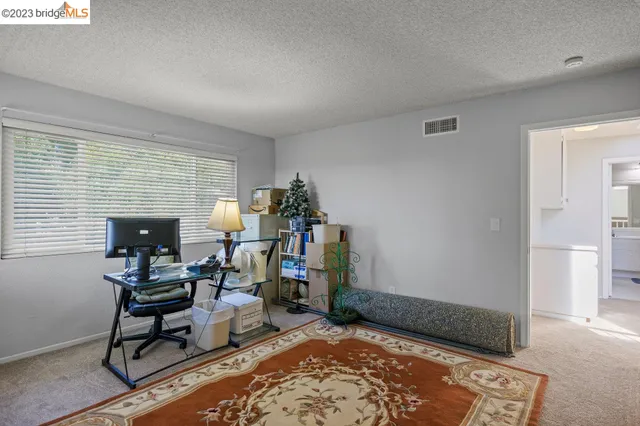 a spacious bathroom with a double vanity sink and a mirror