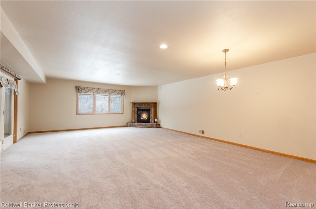 3388 Rivers Edge Drive, Unit 2 Wayne, MI 48184 - Photo 19 of 42 Bank of windows to enjoy wooded view!