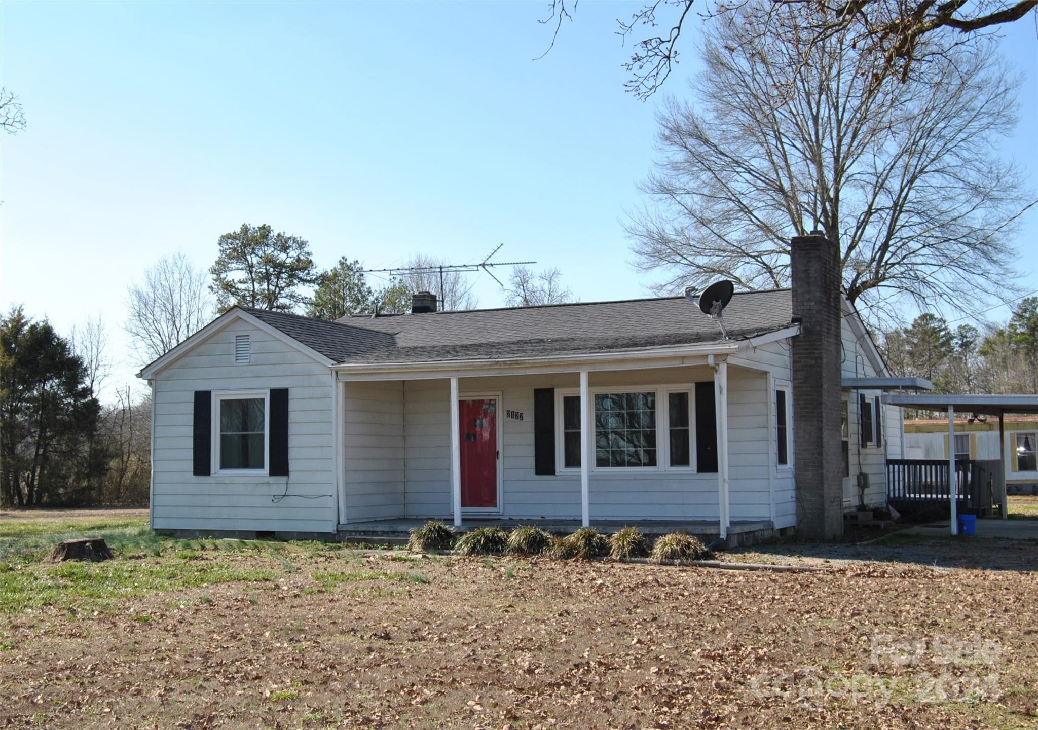 2122 Old Pageland Monroe Road Monroe, NC 28112 - Photo 1 of 24 front view of a house with a yard