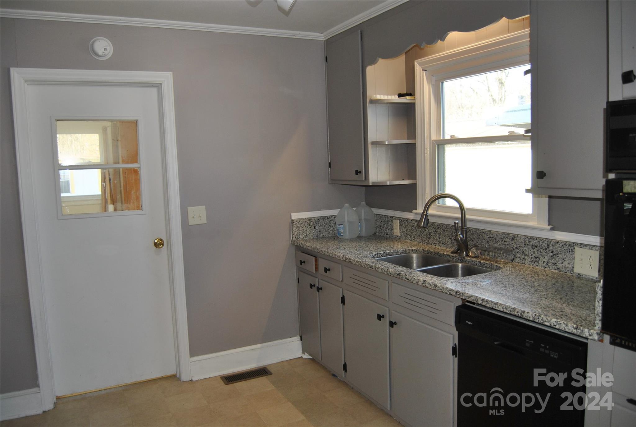 2122 Old Pageland Monroe Road Monroe, NC 28112 - Photo 17 of 24 a kitchen with granite countertop a sink and a window