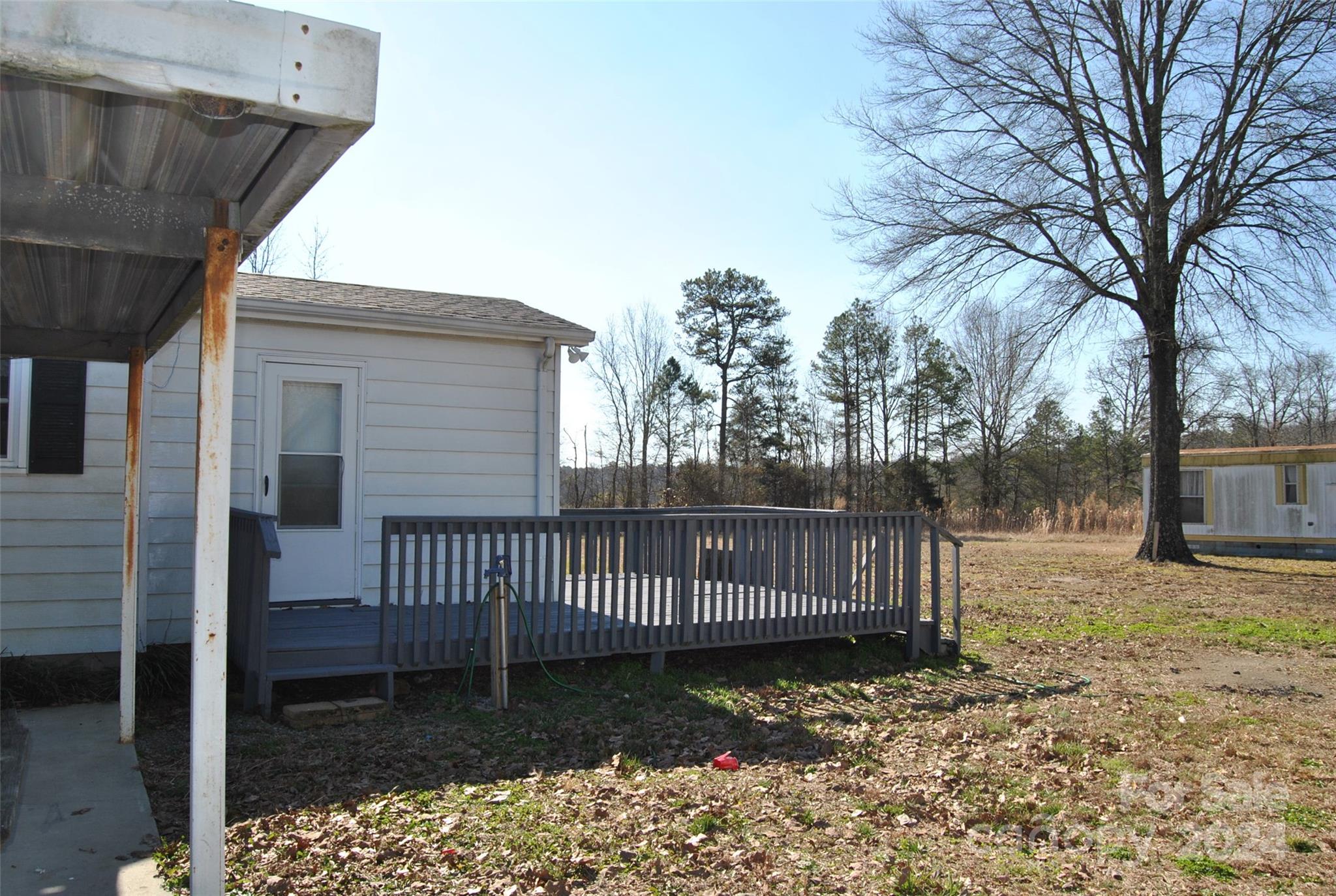 2122 Old Pageland Monroe Road Monroe, NC 28112 - Photo 19 of 24 a view of a deck with a yard