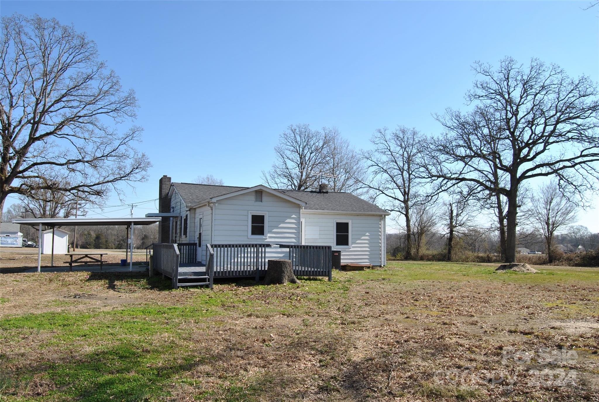 2122 Old Pageland Monroe Road Monroe, NC 28112 - Photo 20 of 24 a view of a house with a yard covered in snow