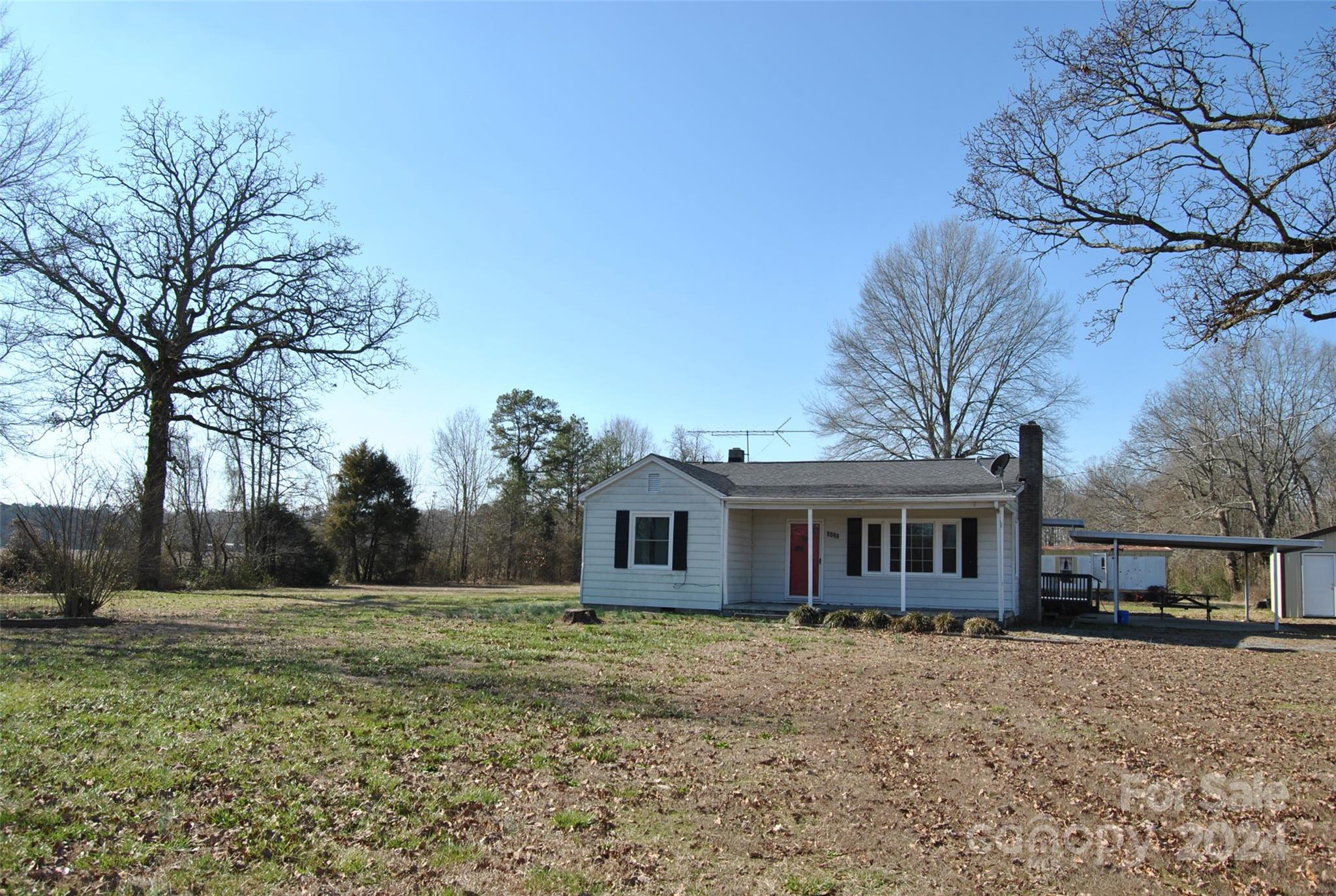 2122 Old Pageland Monroe Road Monroe, NC 28112 - Photo 21 of 24 a view of a house with a yard