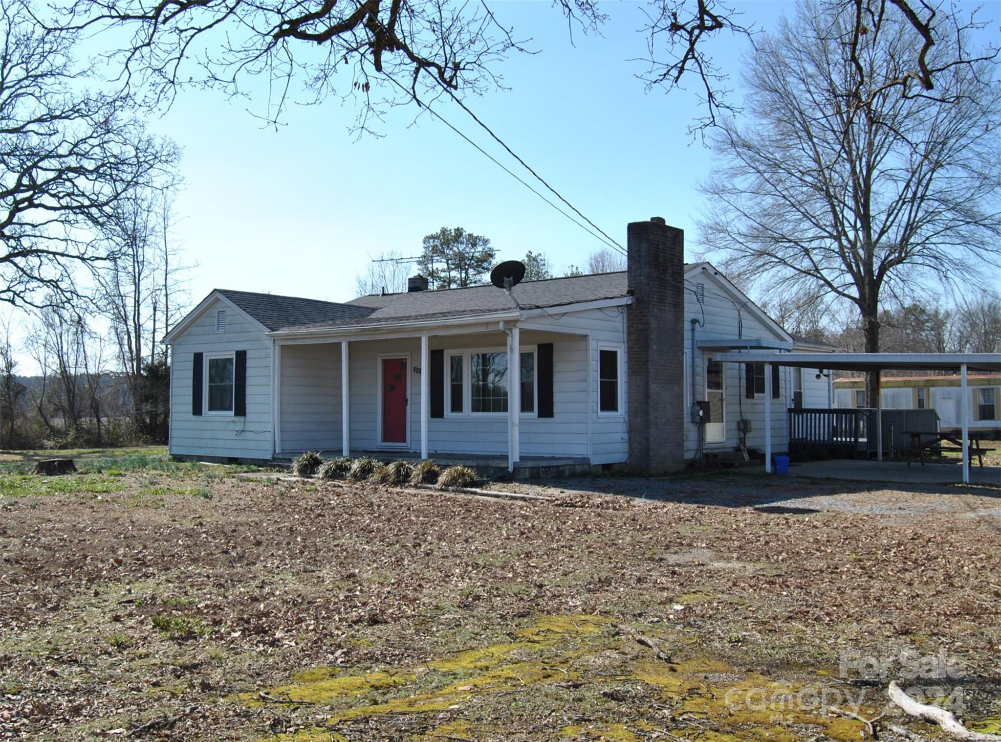 2122 Old Pageland Monroe Road Monroe, NC 28112 - Photo 22 of 24 a front view of a house with a yard