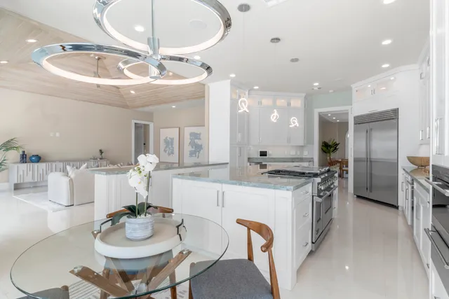 a bathroom with a bathtub shower sink vanity mirror and toilet