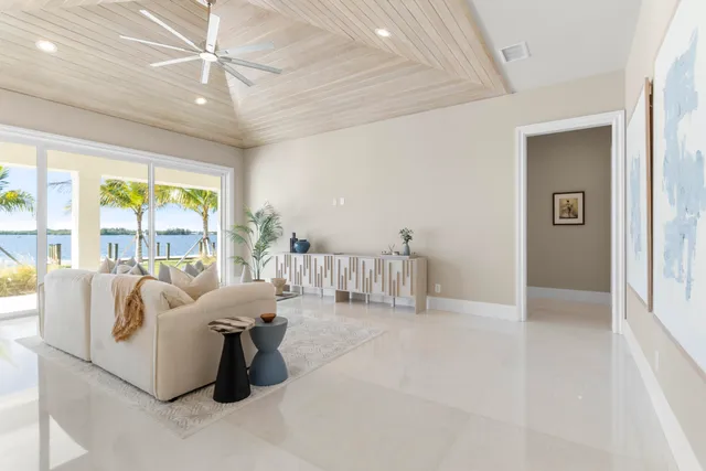 a spacious bathroom with a granite countertop sink a toilet and a mirror