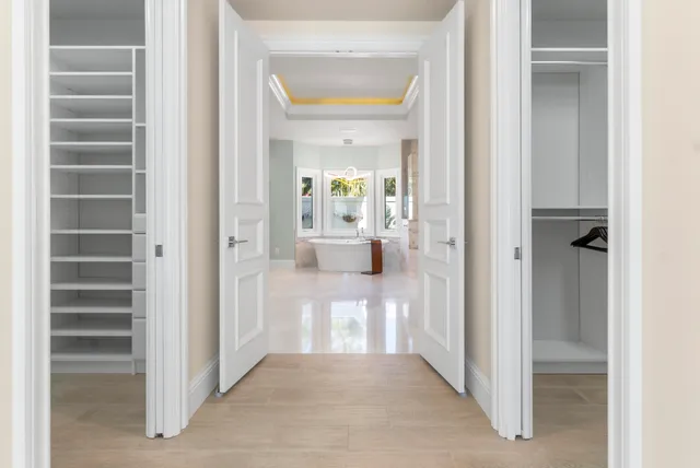 a bedroom with a bed and a refrigerator