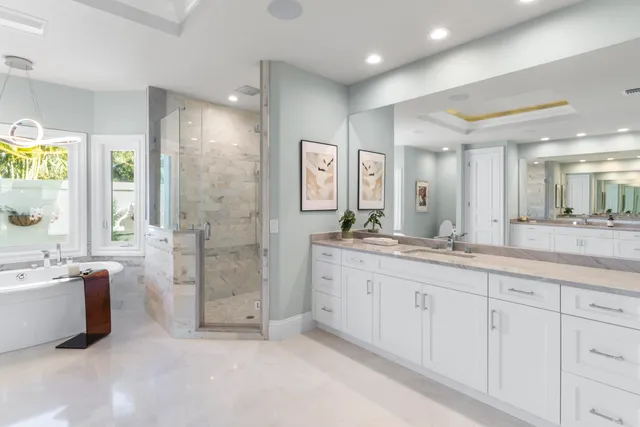 a spacious bedroom with a bed and a couch