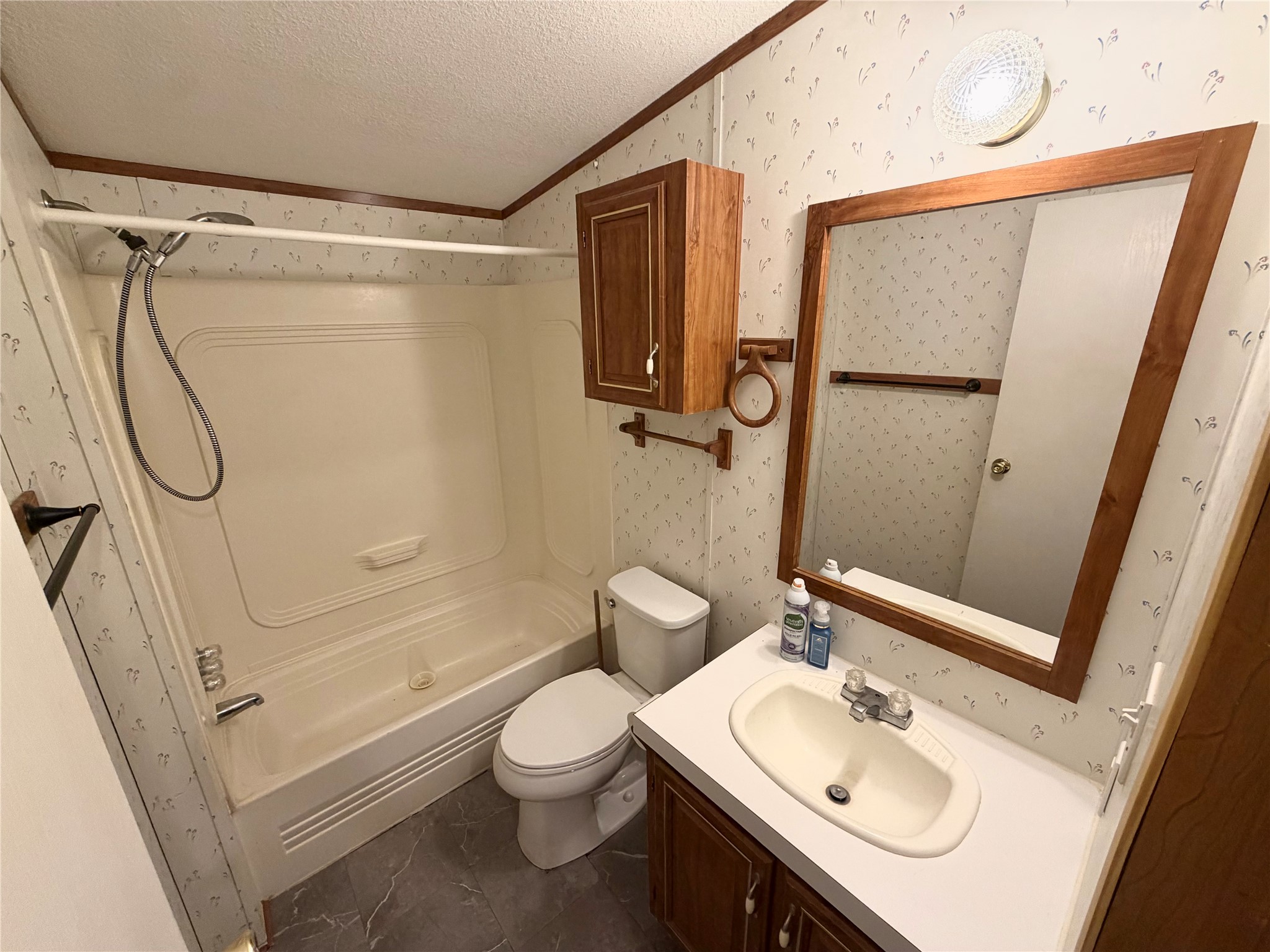 153 Prairie Lea Drive Angleton, TX 77515 - Photo 19 of 30 a bathroom with a sink a toilet and shower