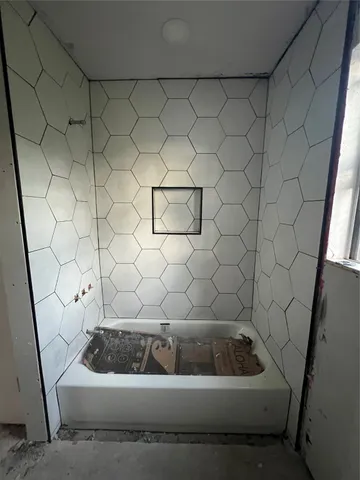 a bathroom with a sink and bathtub